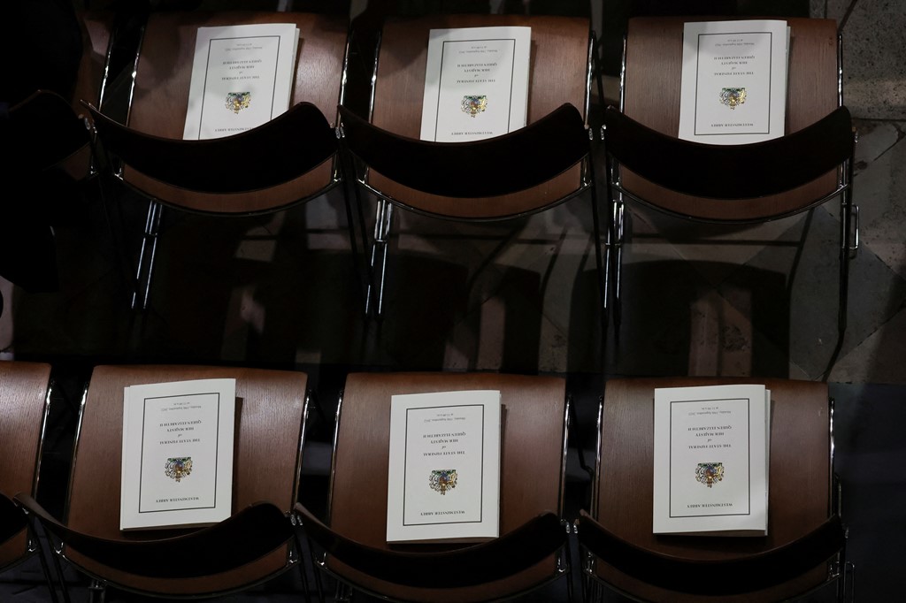 Funeral programs are left on chairs inside Westminster Abbey