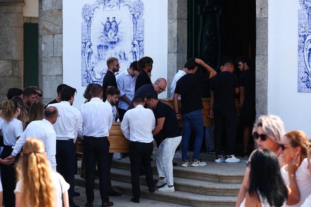 Coffins being carried into church