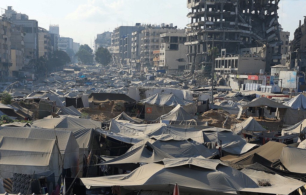 Displaced Palestinians shelter in a tent camp in Gaza City