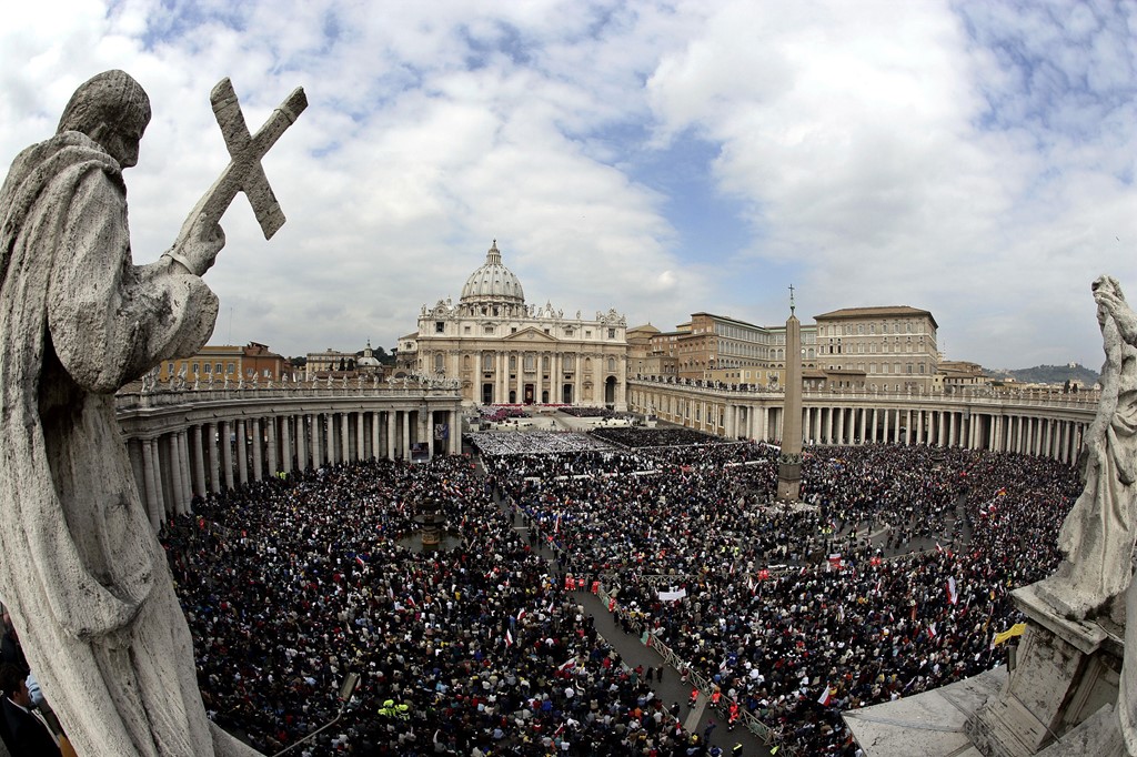 Mourners outside St Peter's in April 2005, for the funeral mass of John Paul II