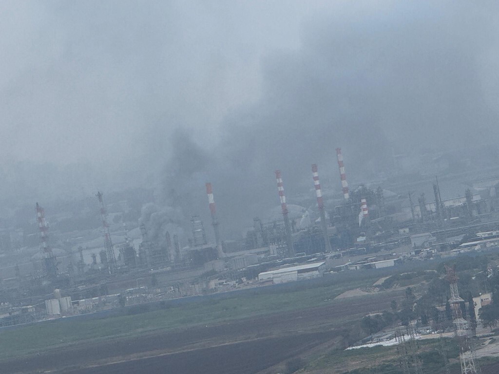 Smoke rising from the refinery yesterday
