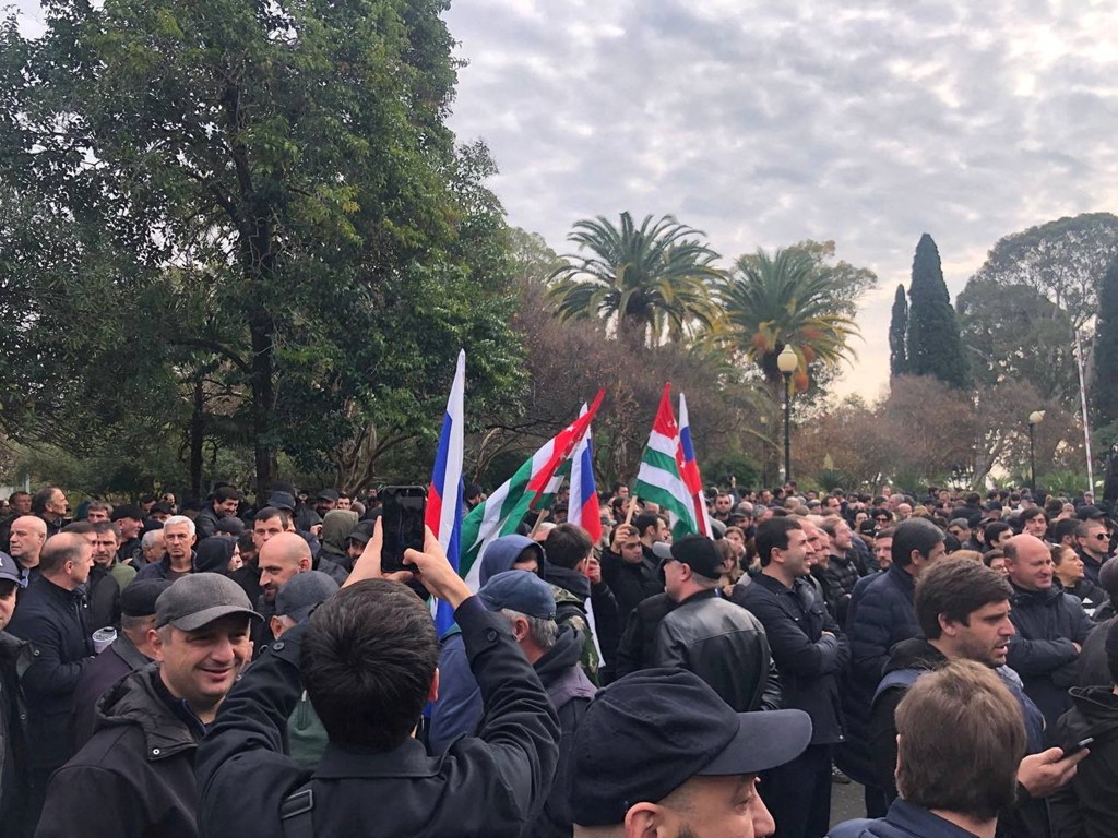 Protesters rally outside the parliament building in Abkhazia