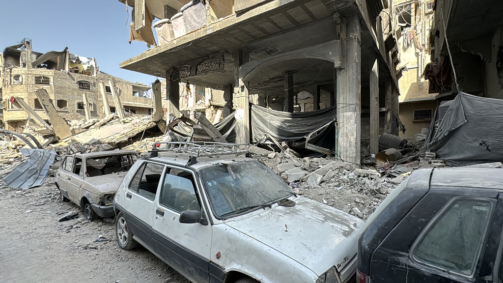 Damaged cars seen after Israeli forces withdrew from the area around Kamal Adwan Hospital in Jabalia