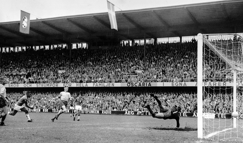 Pele scores in the 1958 World Cup final against Sweden, which Brazil won