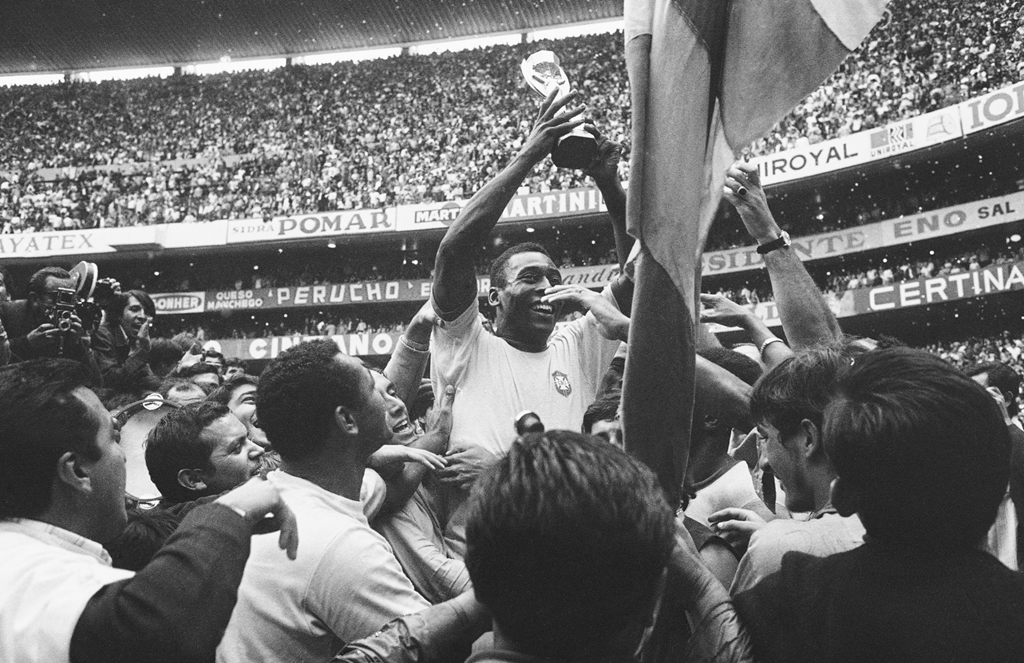 Brazil's Pele holds up his team's Jules Rimet Trophy following Brazil's 4-1 victory over Italy in 1970