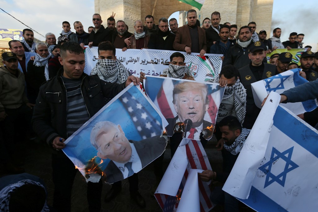 Palestinians burn pictures of Donald Trump and Benjamin Netanyahu in Gaza in 2020