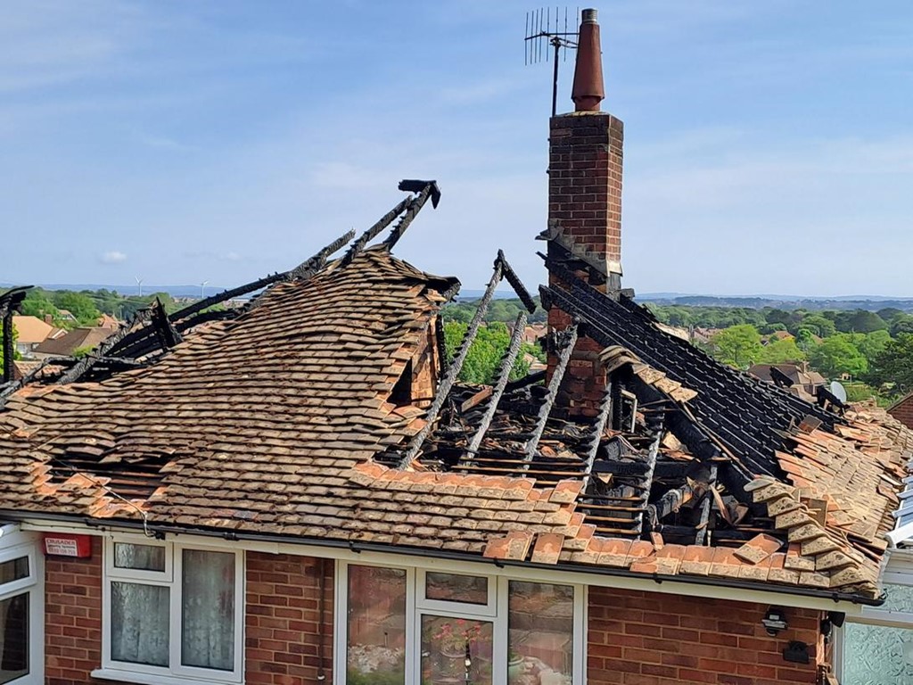 A suspected lightning strike set a roof alight in Eastbourne.