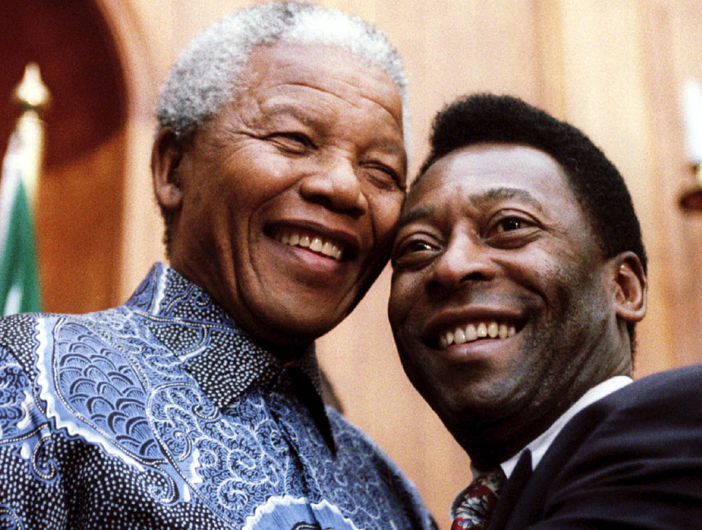 Nelson Mandela and Pele smile for photographers in 1995