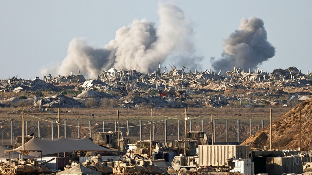 An explosion in Gaza, seen from the Israeli side of the border yesterday